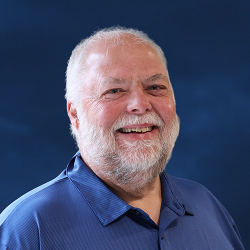 Older adult male smiling at the camera