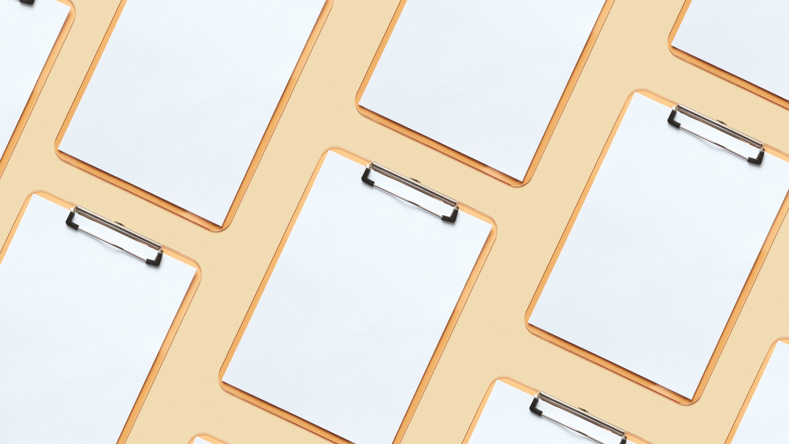 blank paper on clipboards